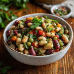 Chimichurri dense bean salad in rustic white bowl